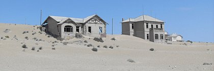 Homes from colonial times in the diamond city of Kolmanskop are seized by the dunes of the Namib Desert. 
Photo: Dominik Rumpf
